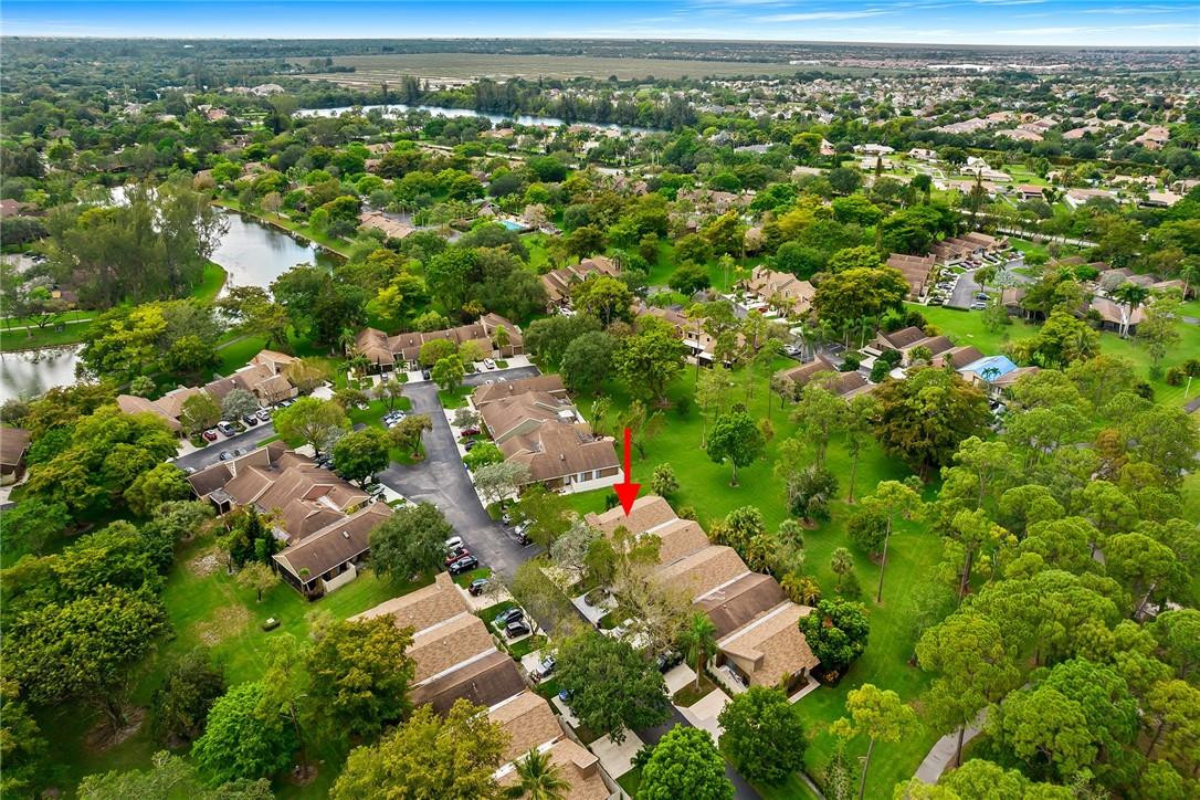 Undisclosed Address Boca Raton, FL 33428 - Photo 31 of 35 an aerial view of residential houses with outdoor space and trees
