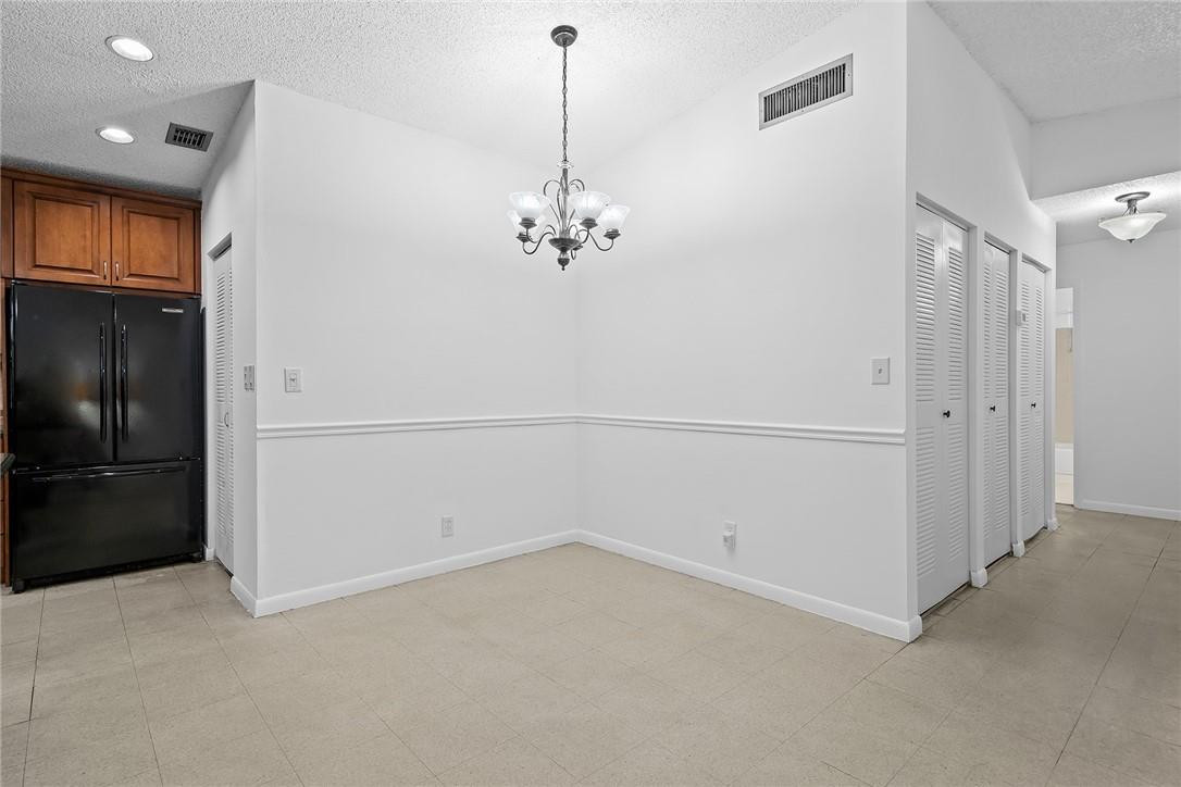 Undisclosed Address Boca Raton, FL 33428 - Photo 10 of 35 a view of a livingroom with an empty space