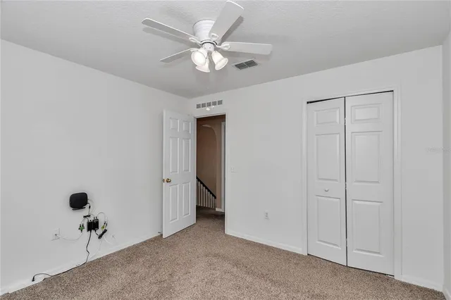 a view of an empty room with a large window