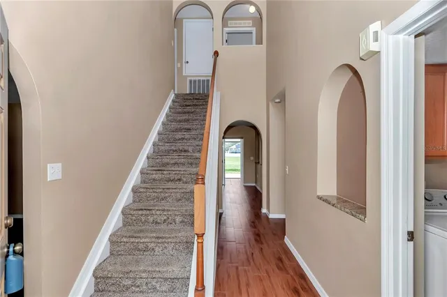 a view of entryway with wooden floor