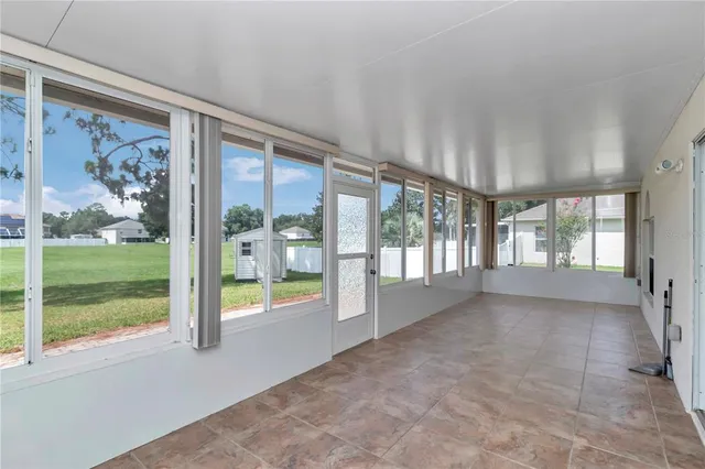 a view of a chair and table in the garden