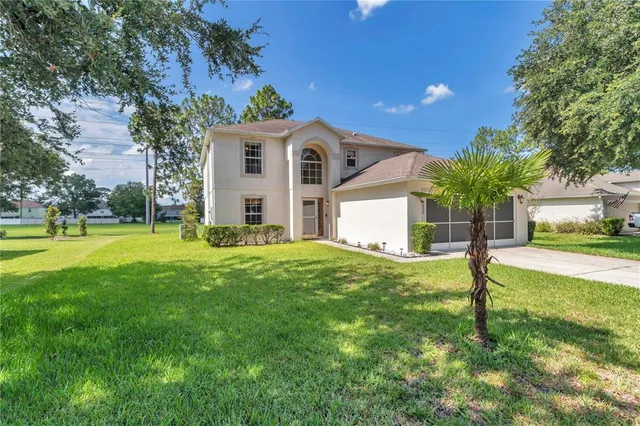 a view of a backyard with small cabin