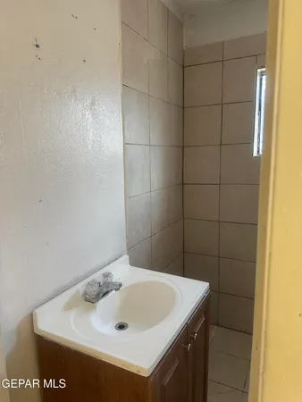 a kitchen with a refrigerator sink and stove