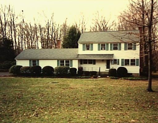 28 Grays Farm Road Weston, CT 06883 - Photo 1 of 1 a front view of a building with a yard