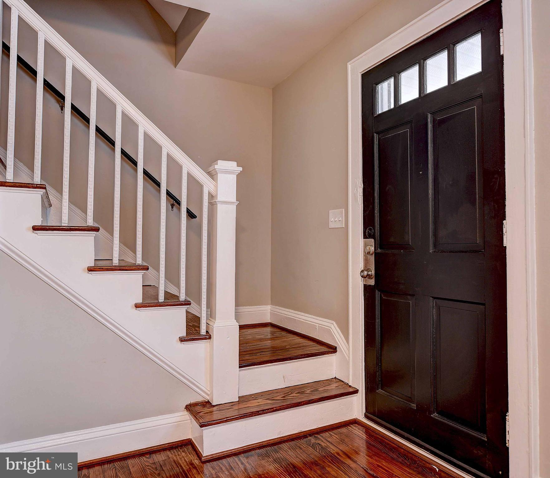 6830 Belclare Road Baltimore, MD 21222 - Photo 3 of 23 a view of staircase with white walls and a window