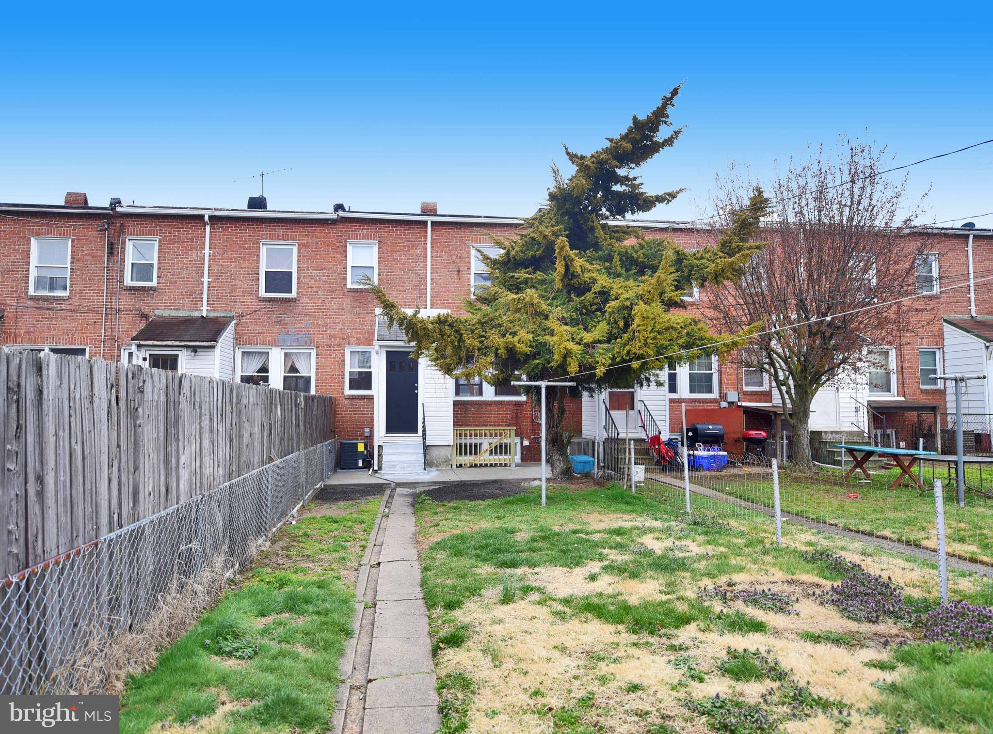 6830 Belclare Road Baltimore, MD 21222 - Photo 22 of 23 a view of a house with a yard and sitting area