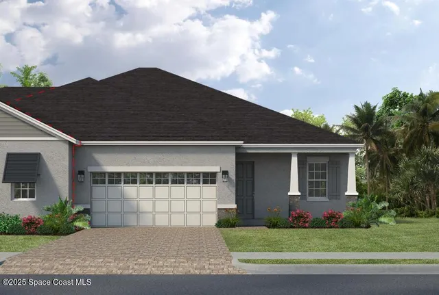 a front view of a house with a garden and garage