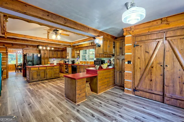a very nice looking dining room with furniture and wooden floor
