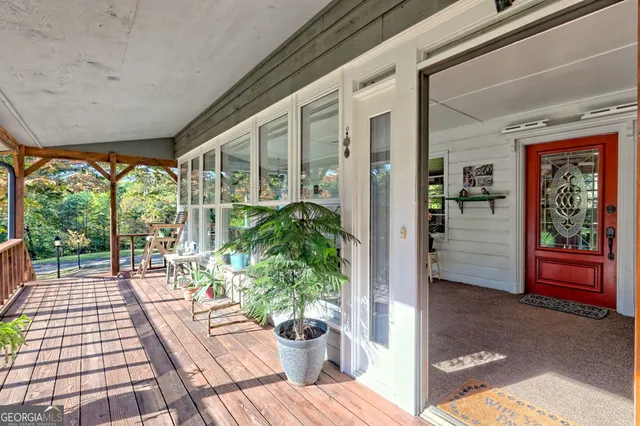 a living room with furniture a ceiling fan and a fireplace