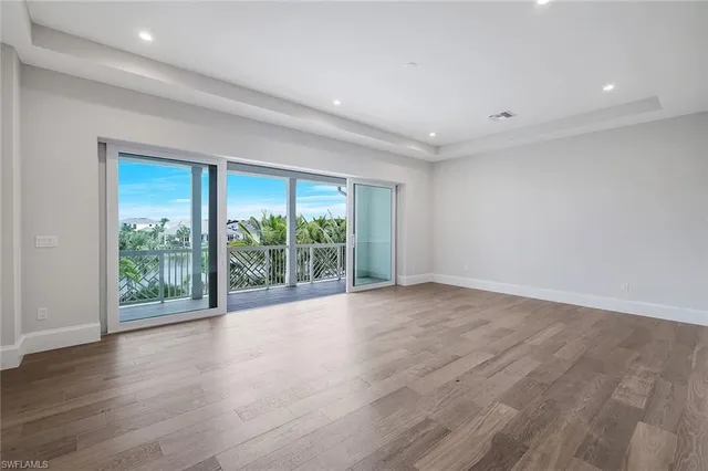 a view of front door with mountain view and wooden floor