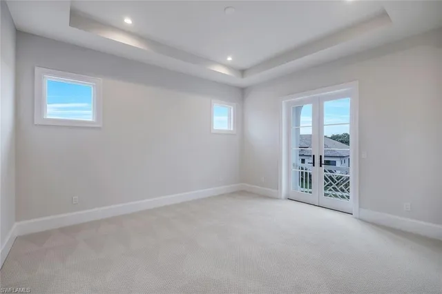 a bathroom with a granite countertop sink a toilet and a mirror