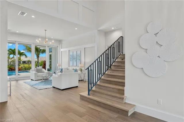 a view of staircase with furniture and window