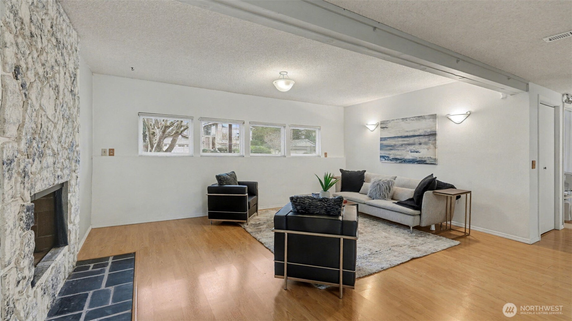 16012 Southeast 172nd Place Renton, WA 98058 - Photo 22 of 31 a bedroom with furniture and a fireplace