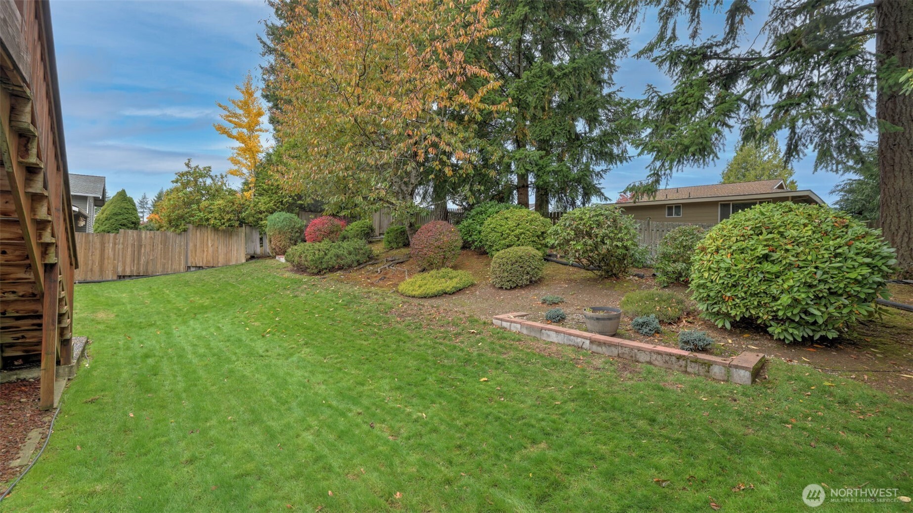 16012 Southeast 172nd Place Renton, WA 98058 - Photo 27 of 31 a view of a backyard with potted plants and large trees