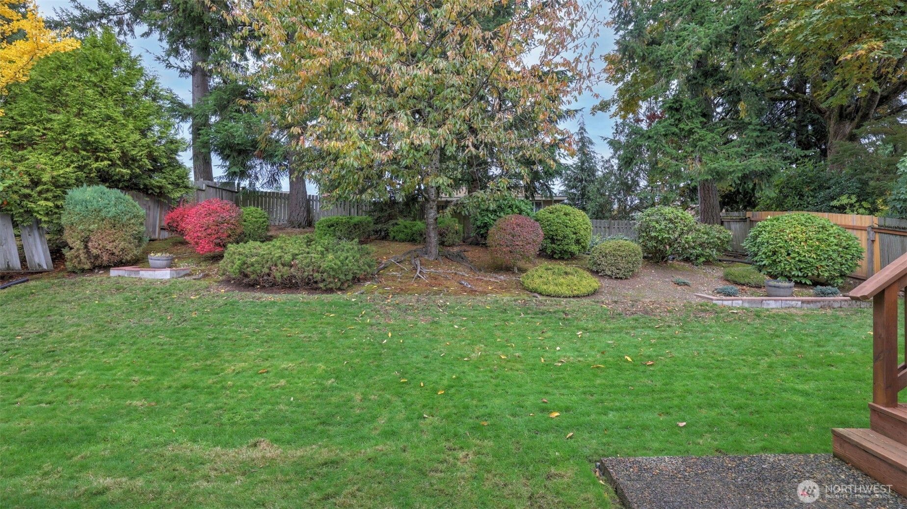 16012 Southeast 172nd Place Renton, WA 98058 - Photo 28 of 31 a backyard of a house with outdoor seating and green space