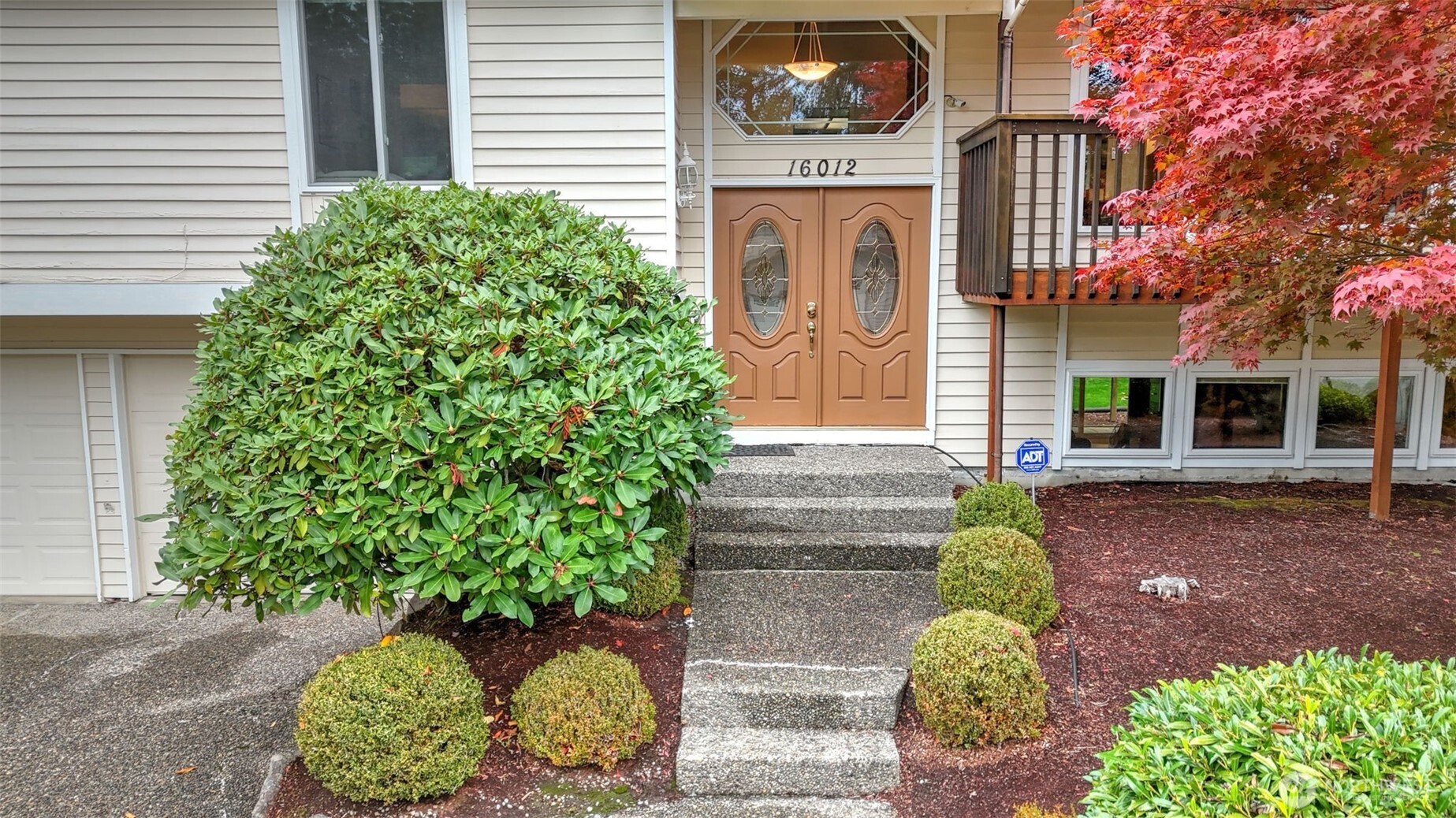 16012 Southeast 172nd Place Renton, WA 98058 - Photo 31 of 31 a front view of a house with garden