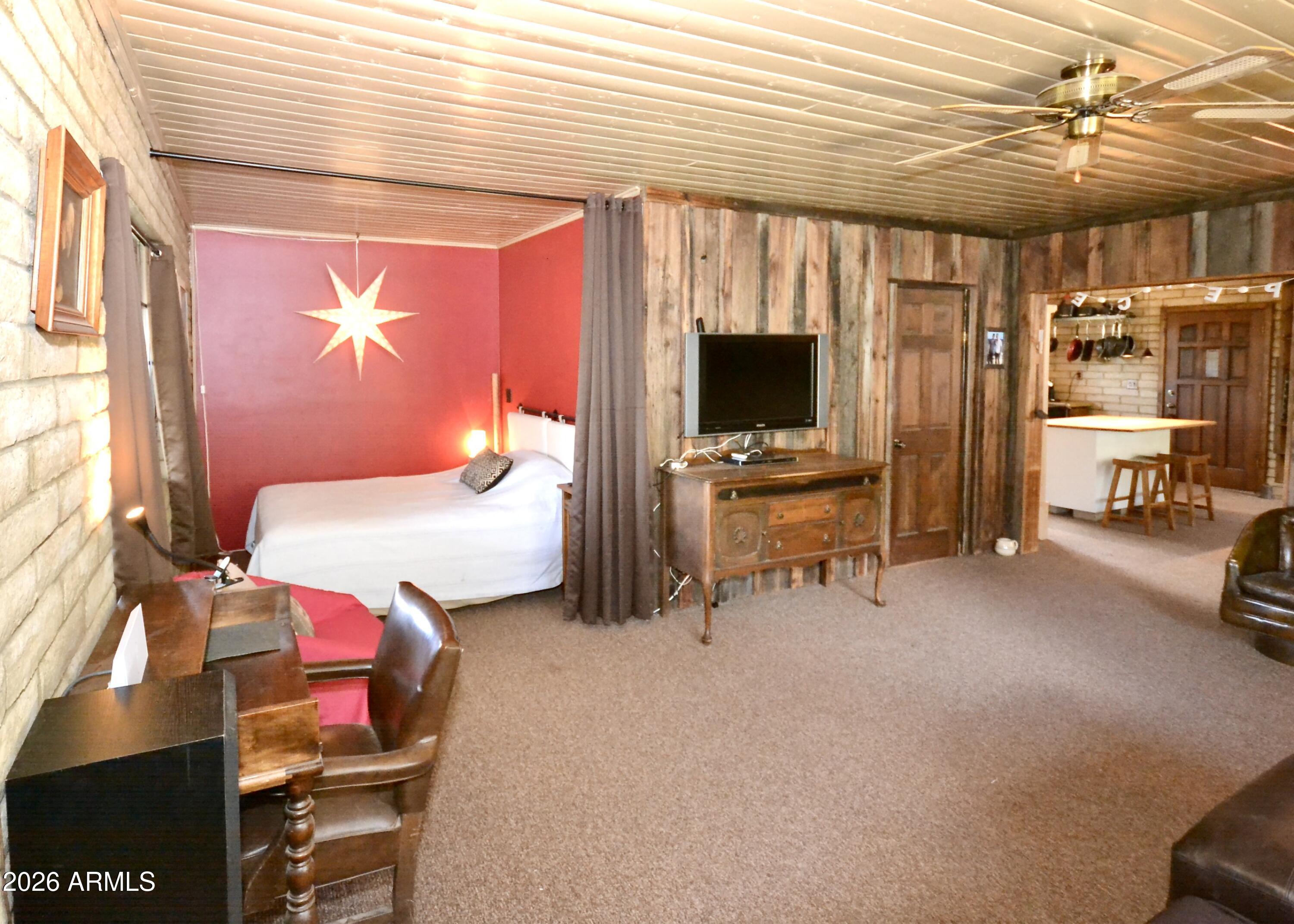 23617 South Demascus Road Crown King, AZ 86343 - Photo 7 of 50 a bedroom with furniture and a flat screen tv