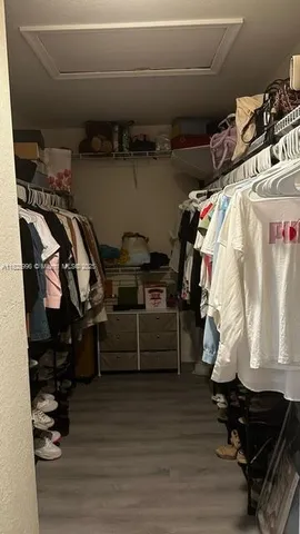 a kitchen with a stove a refrigerator and a sink