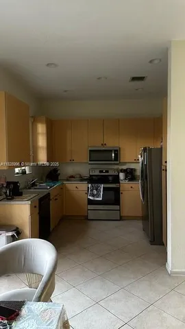 a kitchen with a sink and a stove