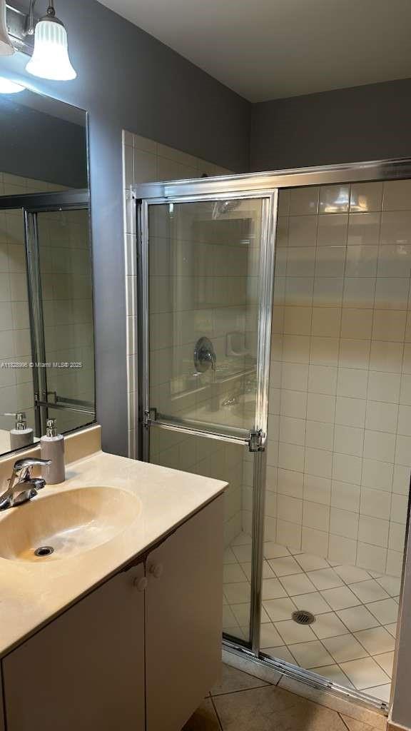 12415 Southwest 42nd Street Miramar, FL 33027 - Photo 31 of 50 a bathroom with a shower sink and mirror