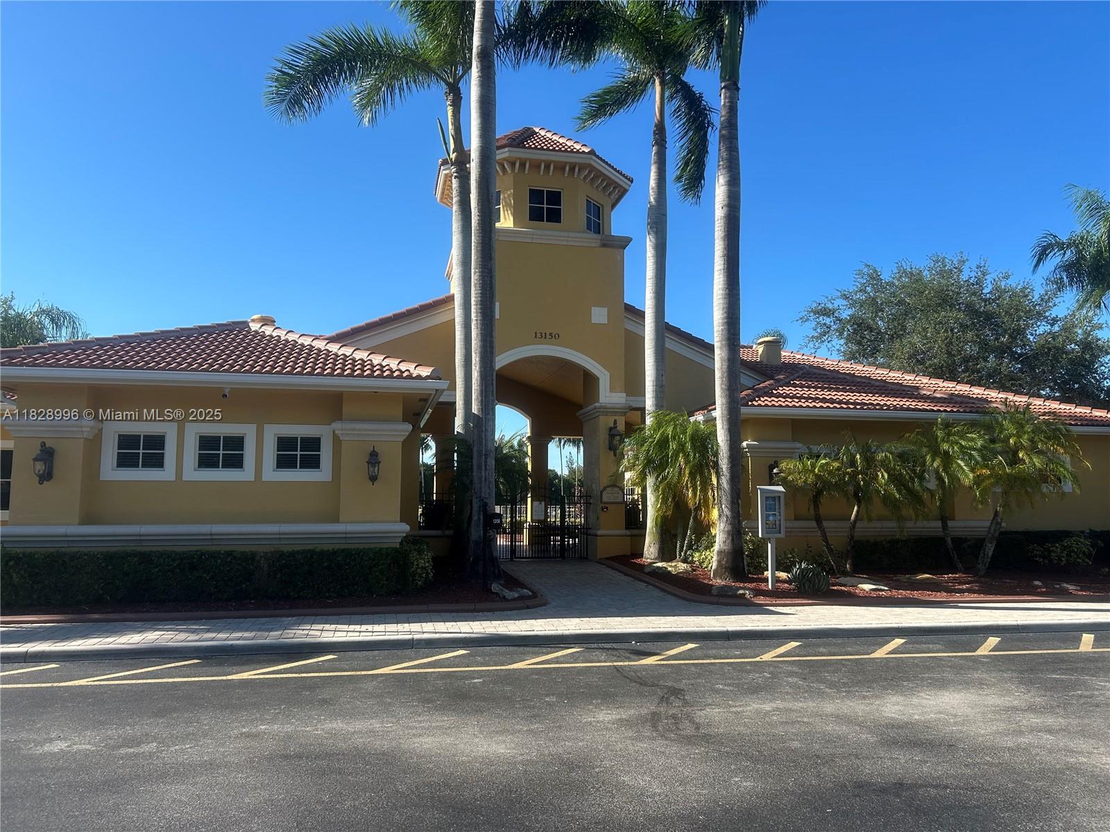 12415 Southwest 42nd Street Miramar, FL 33027 - Photo 40 of 50 a front view of a house with a garden