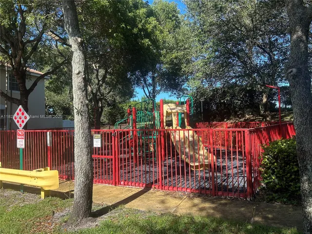 a view of a park with plants and trees