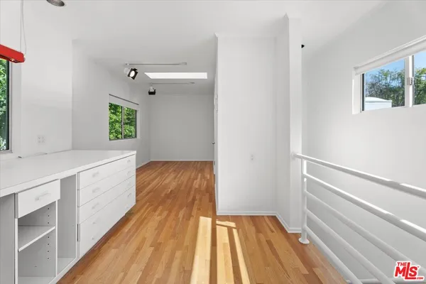 a view of an entryway with wooden floor