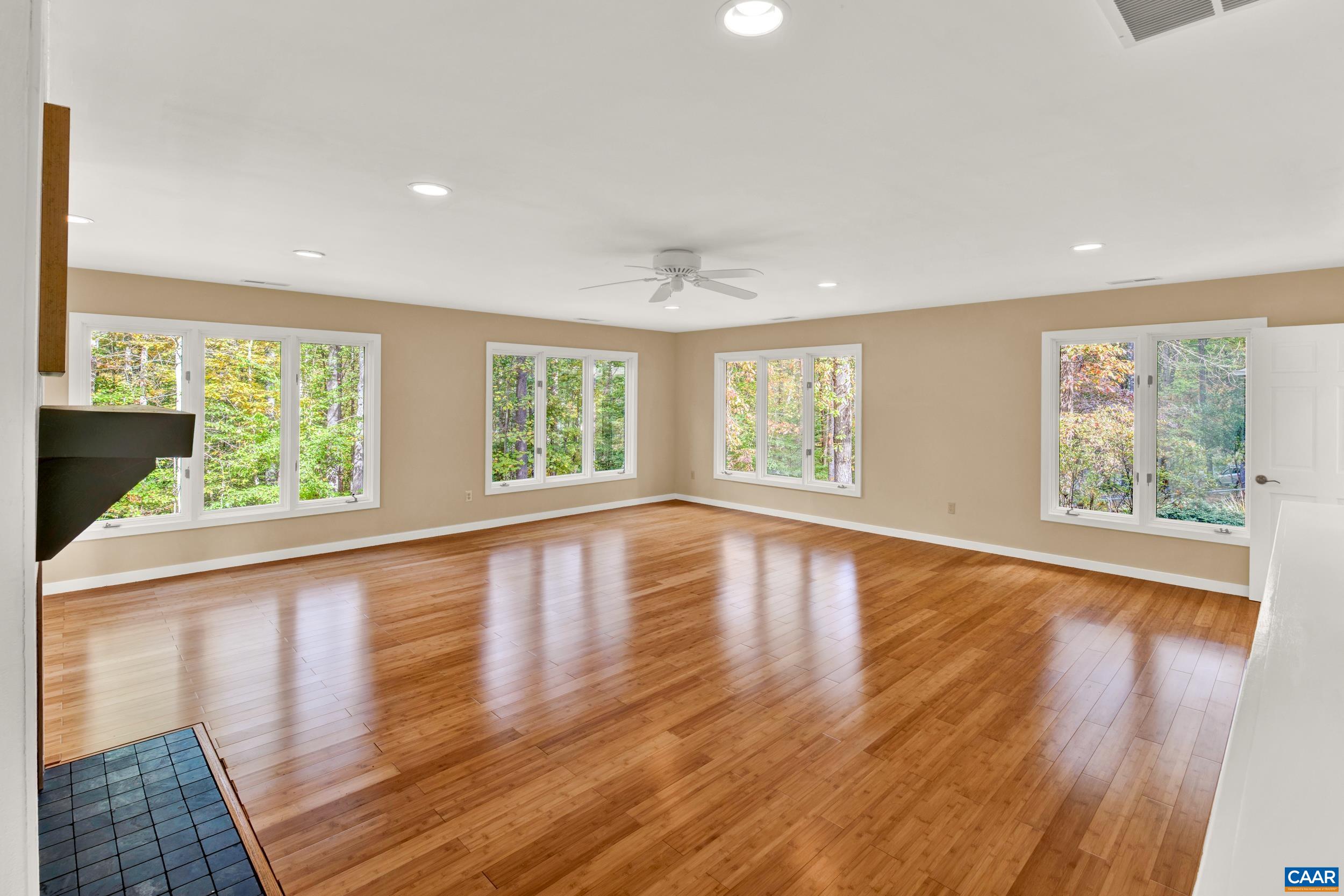 1065 Tilman Road Charlottesville, VA 22901 - Photo 35 of 70 a view of an empty room with wooden floor and a window