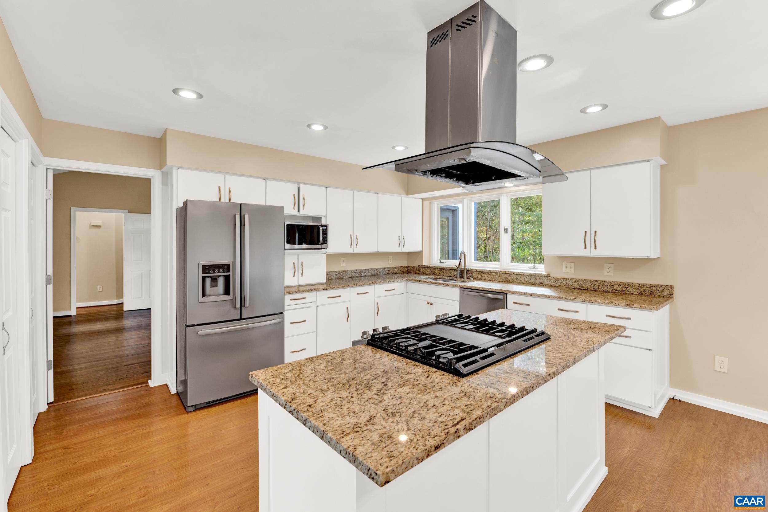 1065 Tilman Road Charlottesville, VA 22901 - Photo 38 of 70 a kitchen with a stove a refrigerator and a sink