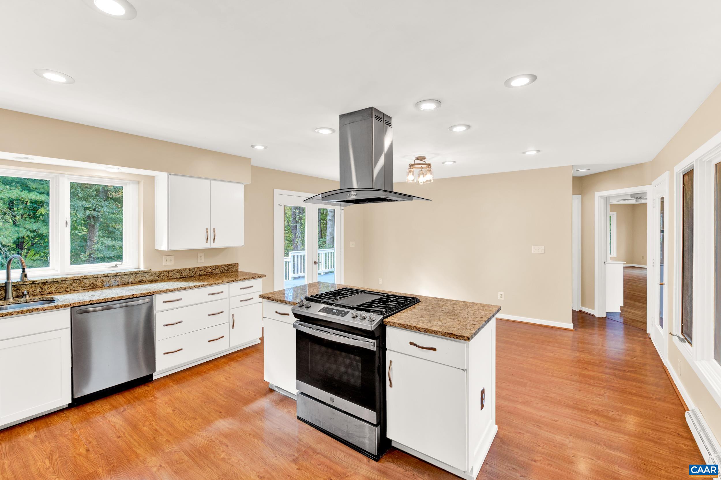 1065 Tilman Road Charlottesville, VA 22901 - Photo 41 of 70 a kitchen with granite countertop stainless steel appliances sink and cabinets