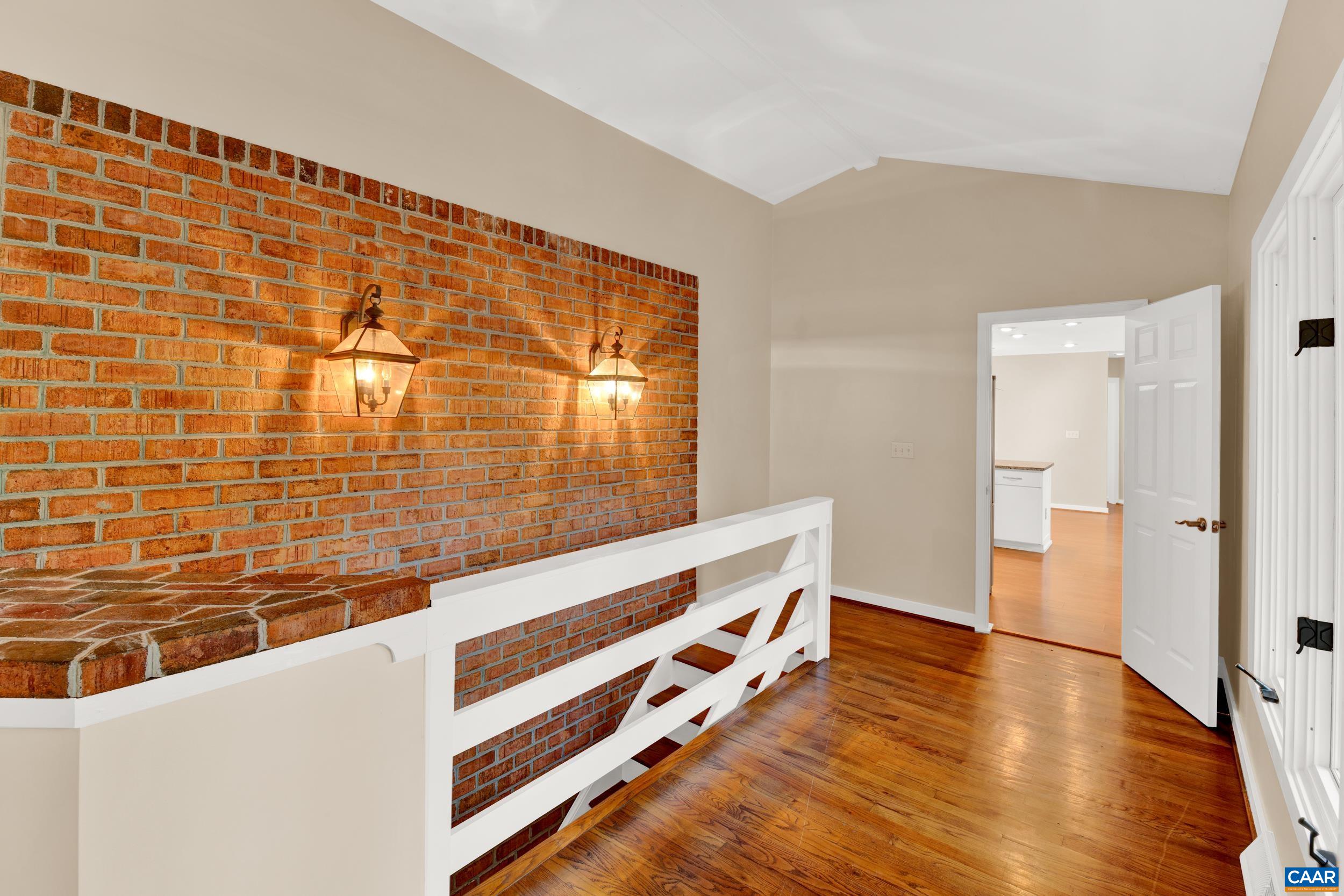 1065 Tilman Road Charlottesville, VA 22901 - Photo 43 of 70 a view of an empty room and wooden floor