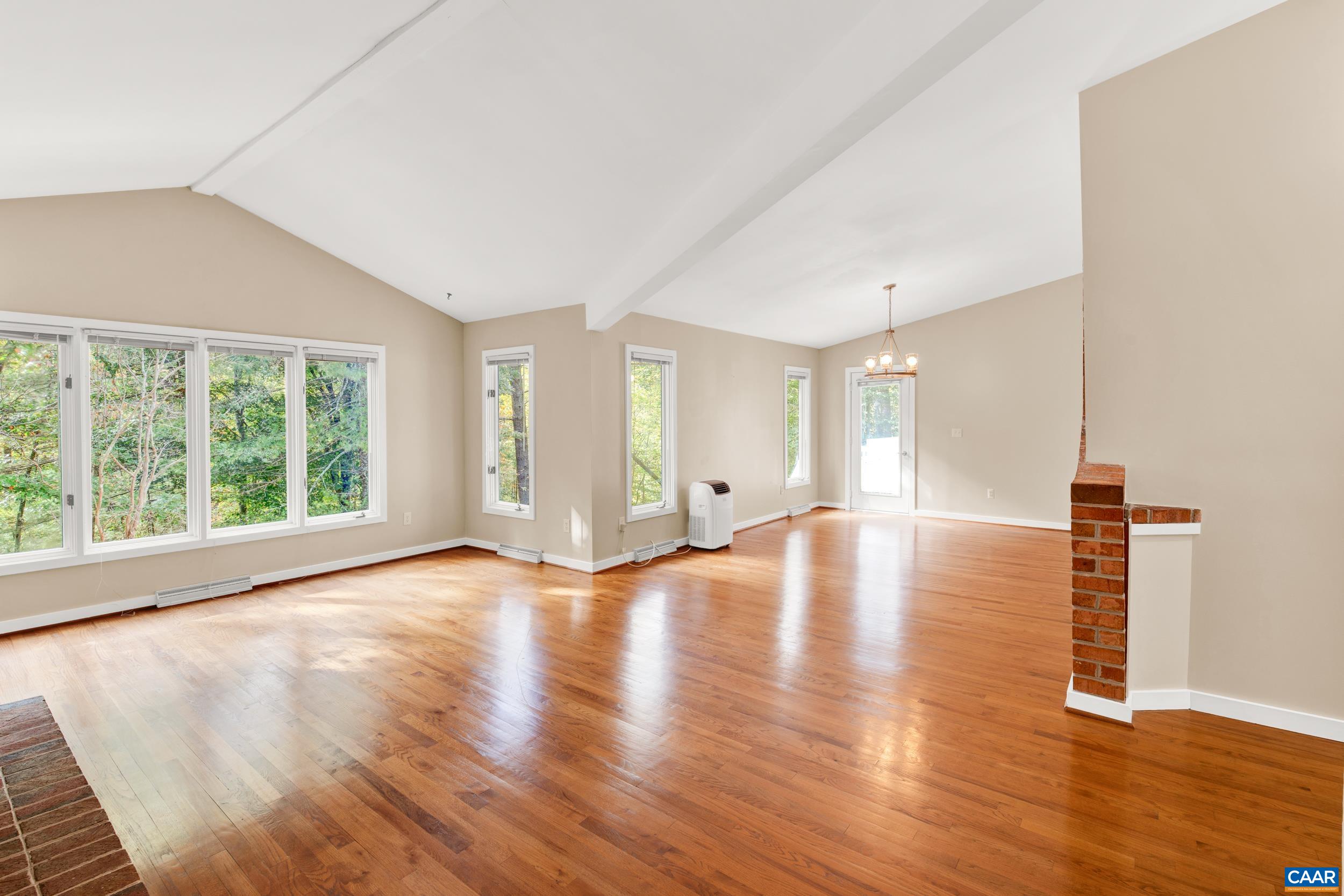 1065 Tilman Road Charlottesville, VA 22901 - Photo 45 of 70 a view of empty room with wooden floor and fan