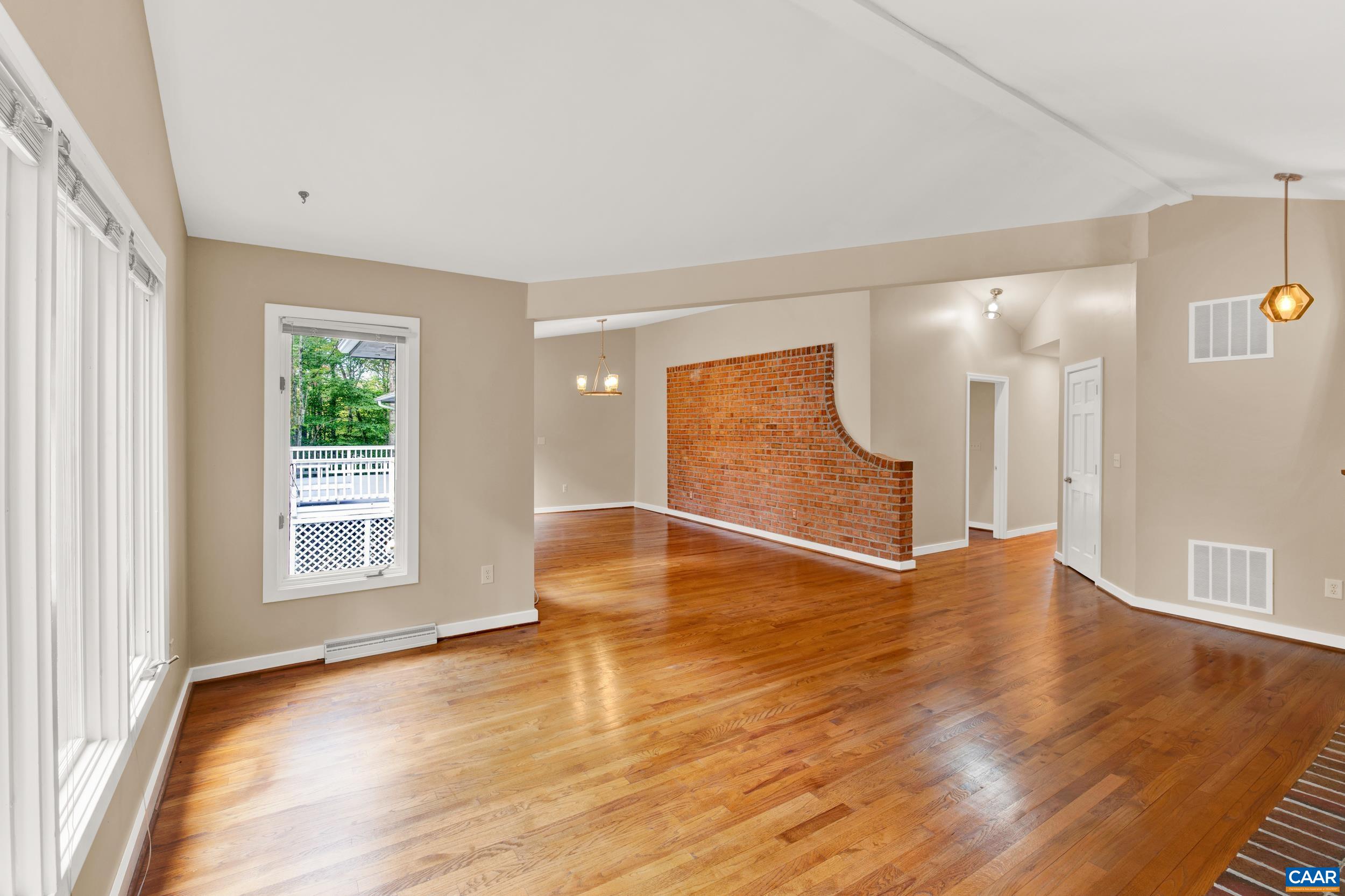1065 Tilman Road Charlottesville, VA 22901 - Photo 46 of 70 a view of empty room with wooden floor and fan