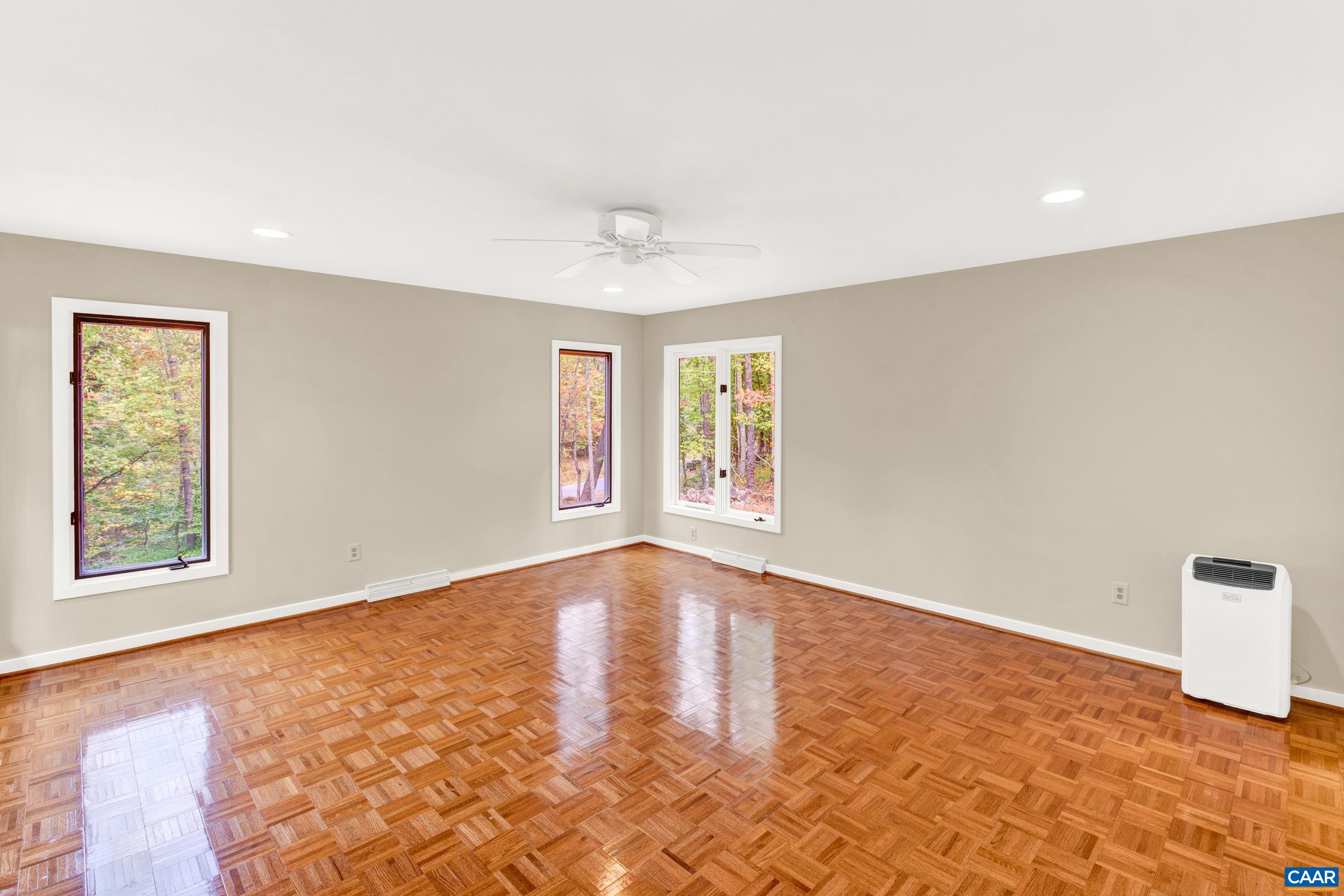 1065 Tilman Road Charlottesville, VA 22901 - Photo 52 of 70 wooden floor in an empty room with a window