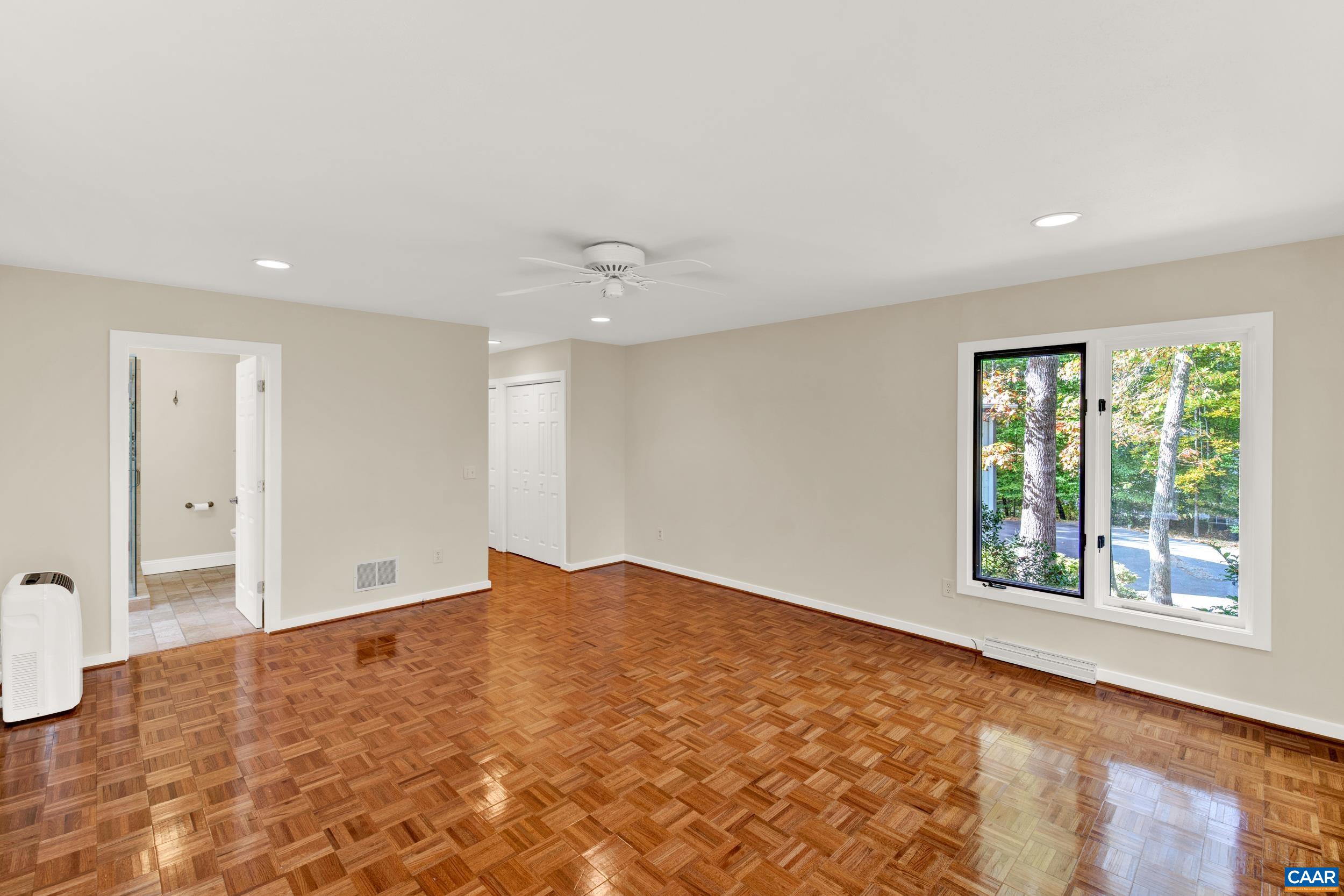 1065 Tilman Road Charlottesville, VA 22901 - Photo 54 of 70 wooden floor in an empty room with a window