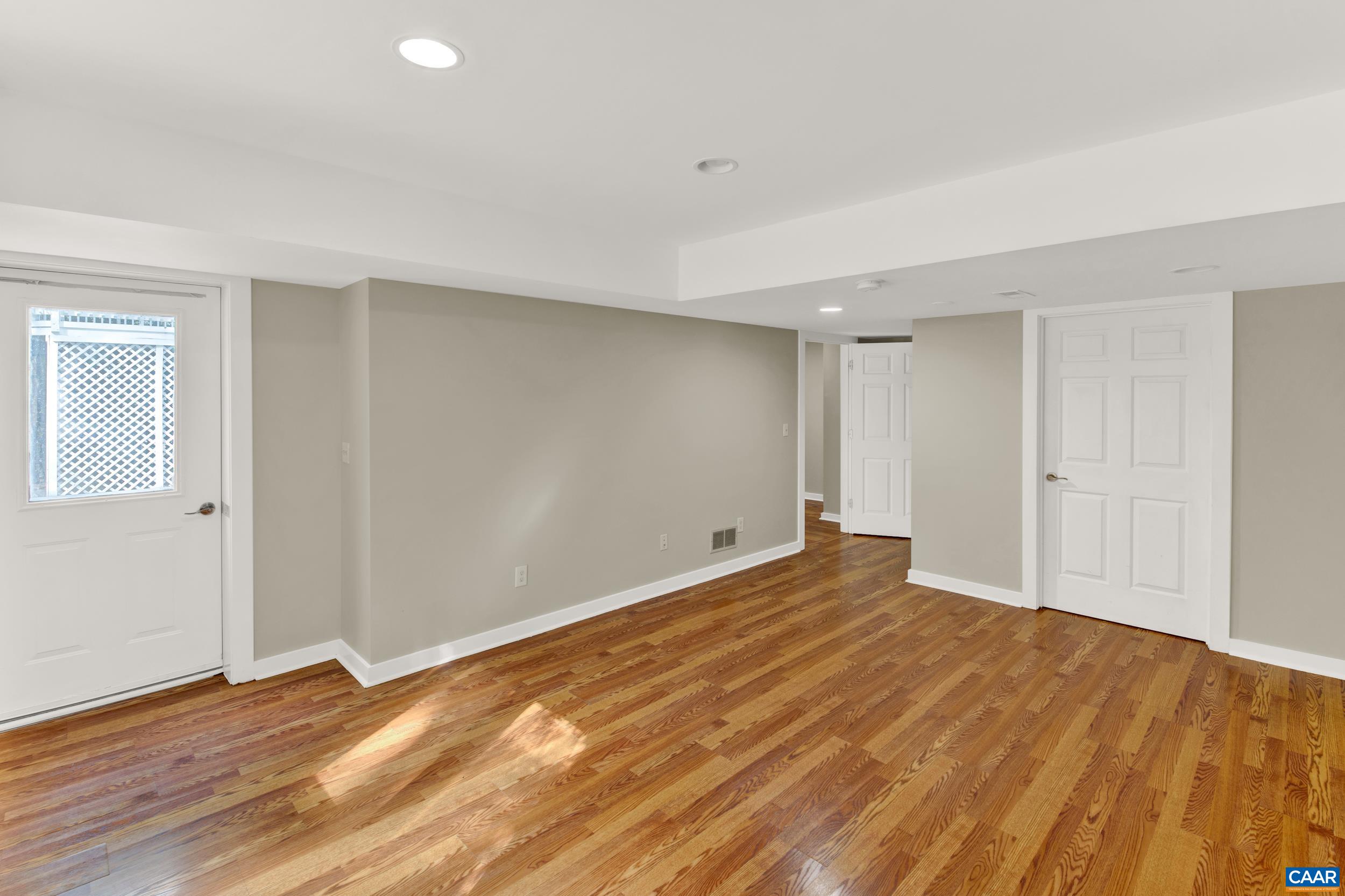 1065 Tilman Road Charlottesville, VA 22901 - Photo 58 of 70 a view of an empty room and wooden floor