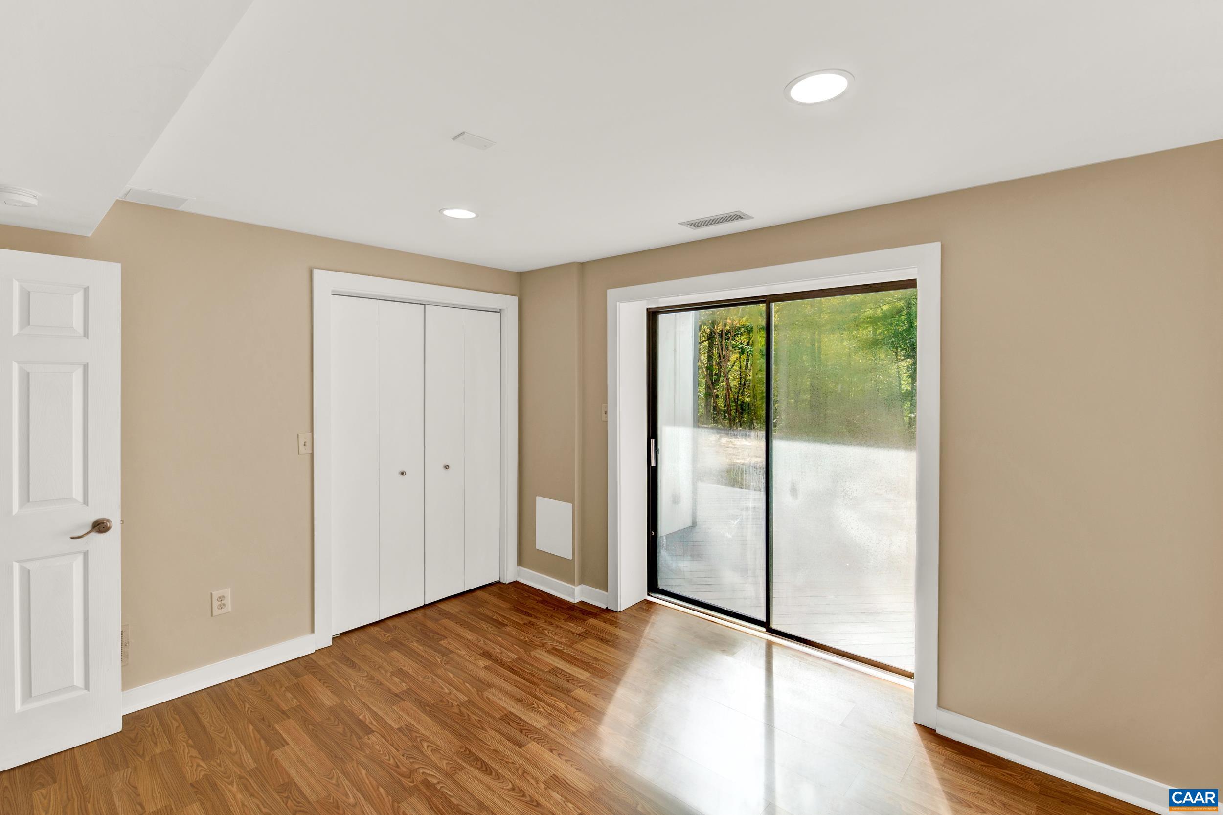 1065 Tilman Road Charlottesville, VA 22901 - Photo 66 of 70 a view of empty room with wooden floor