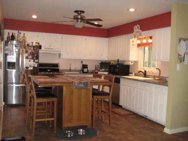 137 South Anderson Road New Lenox, IL 60451 - Photo 7 of 24 a kitchen with stainless steel appliances kitchen island granite countertop a sink a stove a dining table and chairs