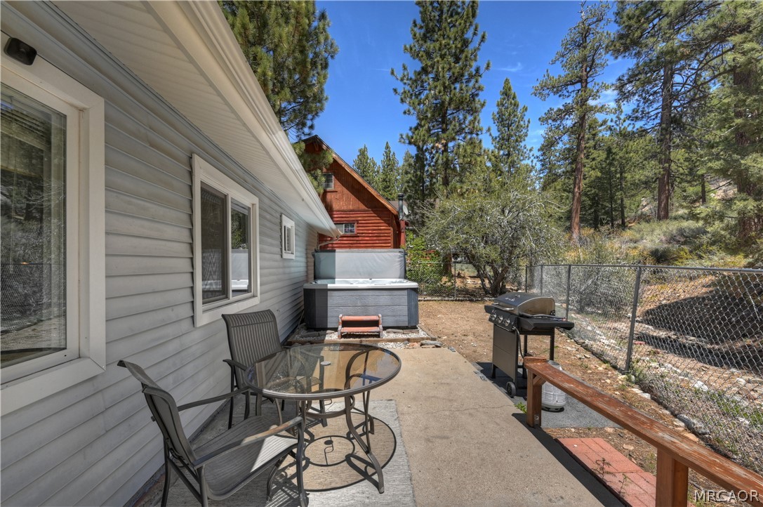 1099 Canyon Road Fawnskin, CA 92333 - Photo 34 of 39 a view of a patio with iron fence