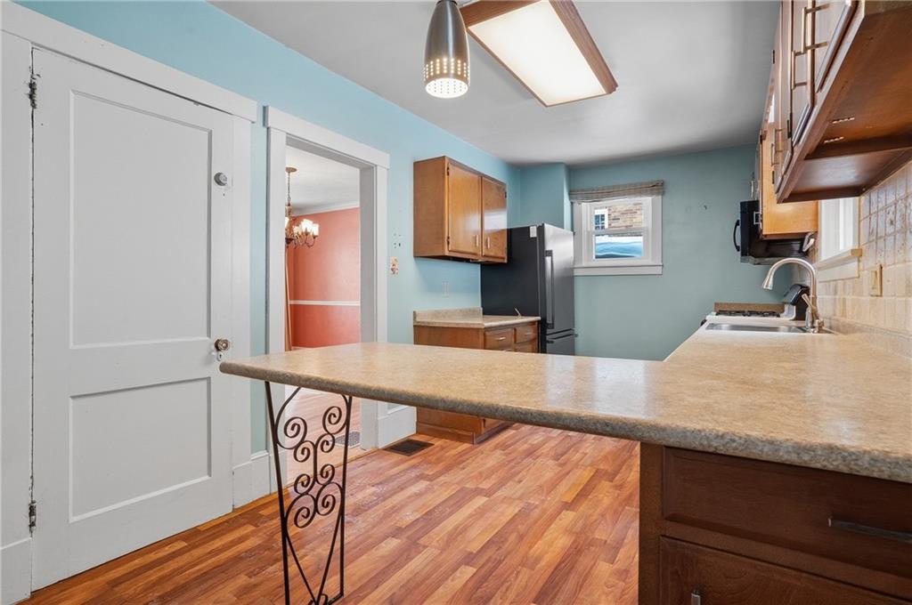 230 West Fulton Street Butler, PA 16001 - Photo 13 of 40 a view of a kitchen from a dining room