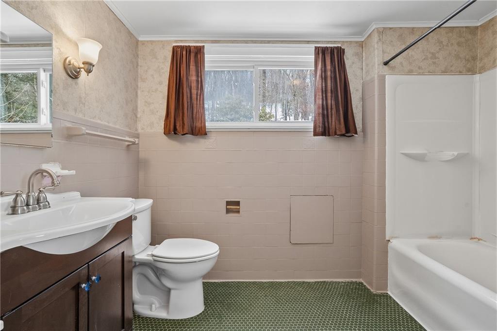 230 West Fulton Street Butler, PA 16001 - Photo 20 of 40 a bathroom with a sink a toilet and shower