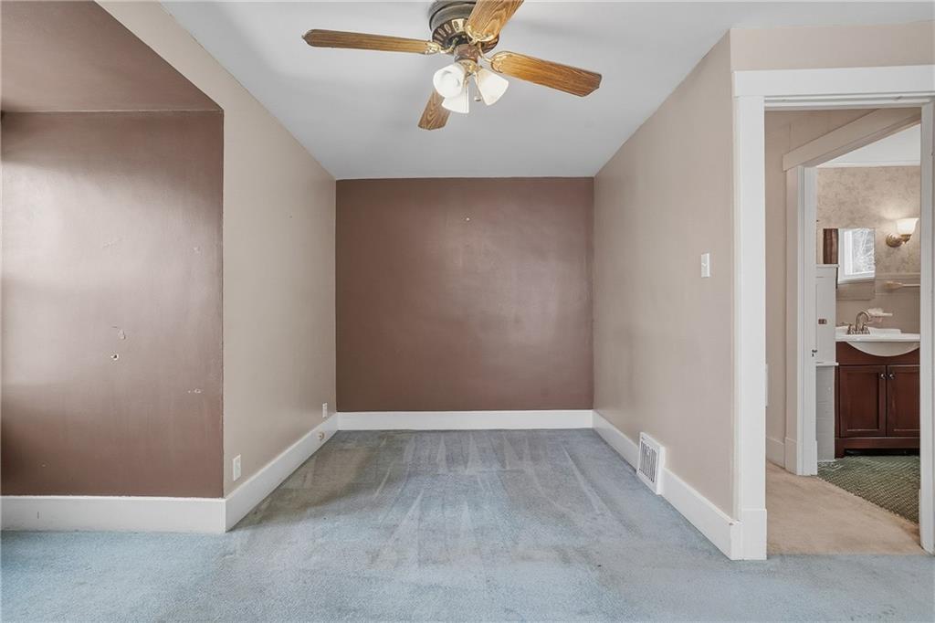230 West Fulton Street Butler, PA 16001 - Photo 24 of 40 wooden floor in an empty room and a bathroom