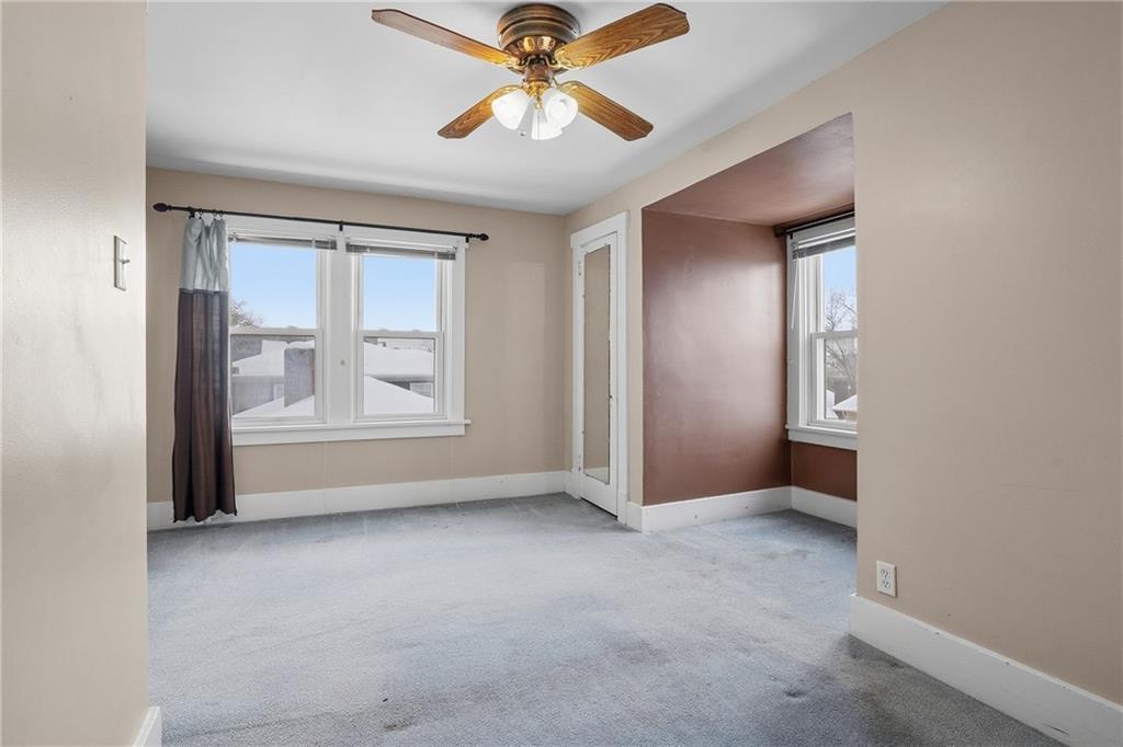 230 West Fulton Street Butler, PA 16001 - Photo 25 of 40 an empty room with windows and fan
