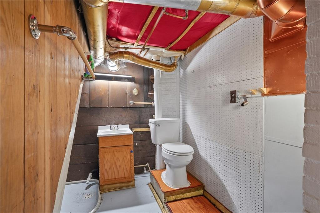 230 West Fulton Street Butler, PA 16001 - Photo 30 of 40 a bathroom with a toilet and a mirror