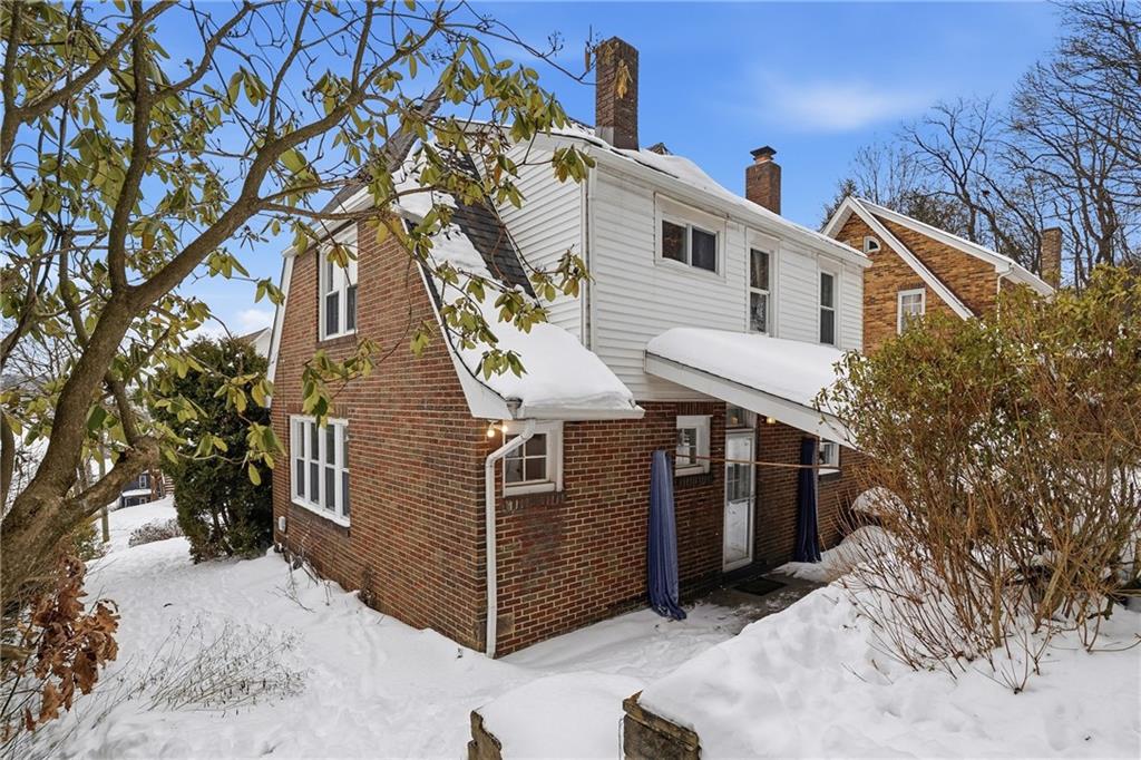 230 West Fulton Street Butler, PA 16001 - Photo 36 of 40 a view of a house with a yard covered in snow