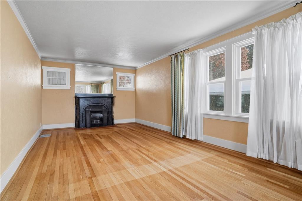 230 West Fulton Street Butler, PA 16001 - Photo 5 of 40 a view of an empty room with wooden floor and a window