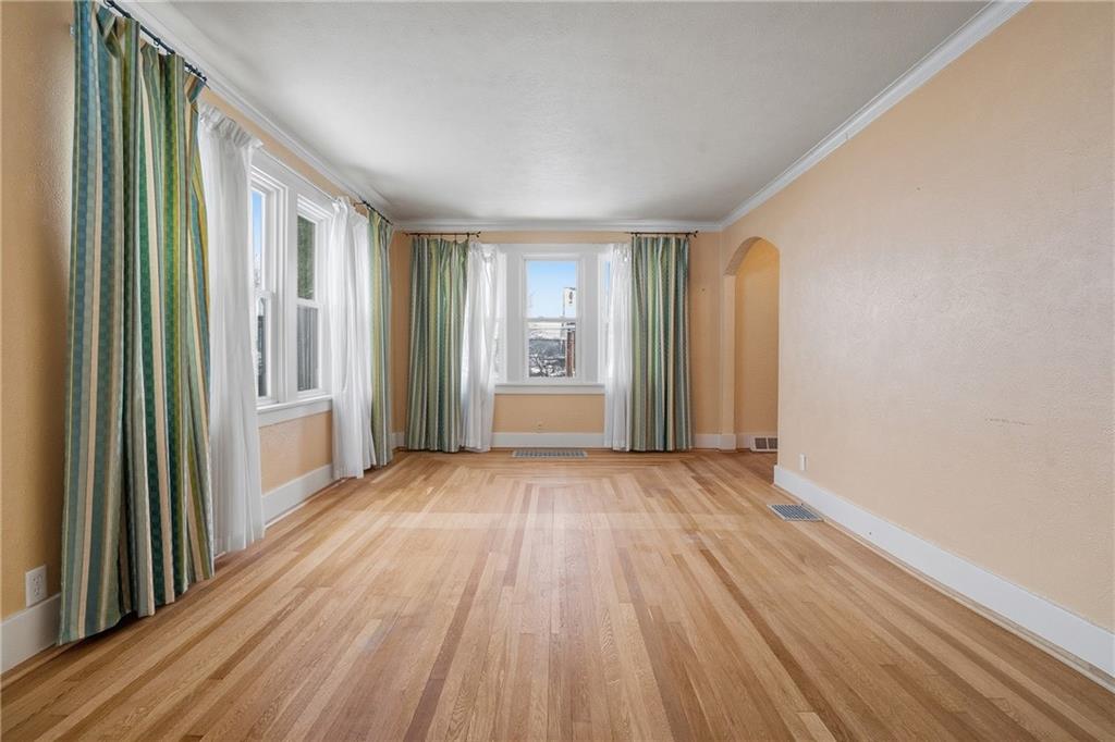 230 West Fulton Street Butler, PA 16001 - Photo 6 of 40 a view of a room with wooden floor and windows