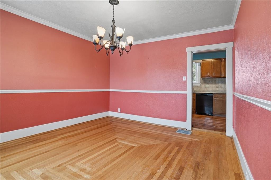 230 West Fulton Street Butler, PA 16001 - Photo 7 of 40 a view of a big room with wooden floor and chandelier