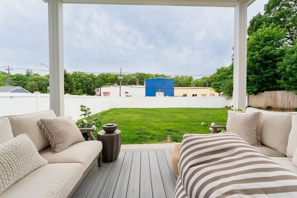 38 Cherry Street, Unit B Hudson, MA 01749 - Photo 32 of 33 a view of a couches in a patio with a yard