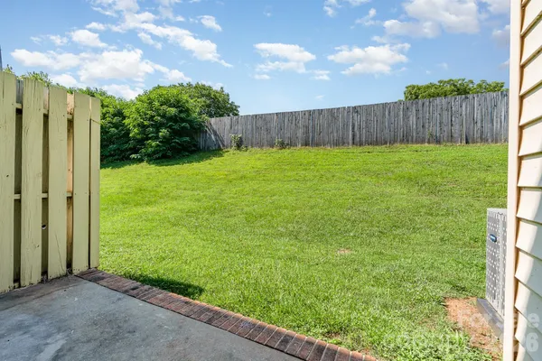 a view of backyard with garden and trees
